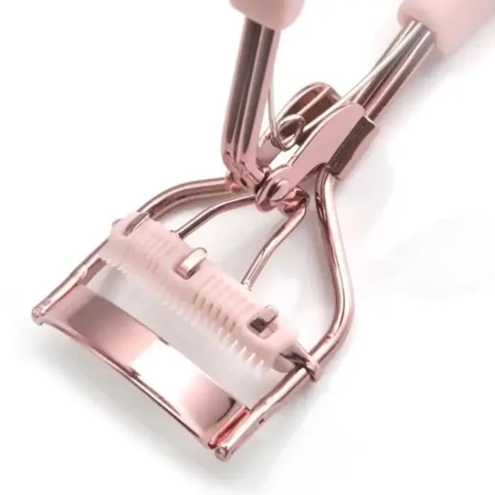 Recourbe-cils professionnel rose avec peigne pour des courbes parfaites