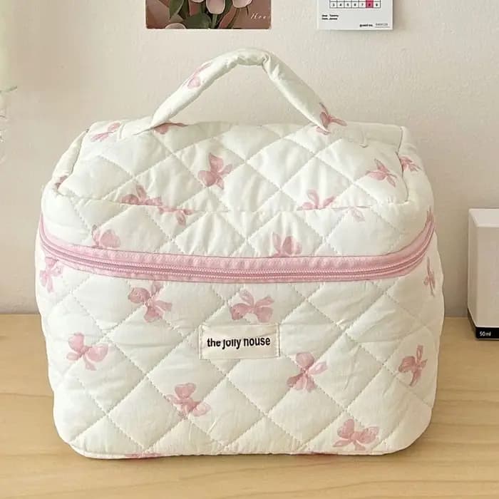 Trousse de maquillage matelassée à nœud blanc