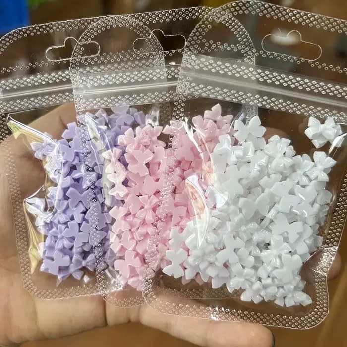 50/100 pièces rose blanc Kawaii arc breloque pour ongles 3D résine nœud papillon Flatback ongles gem