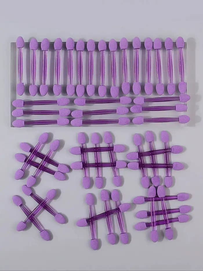 50 bâtonnets de fard à paupières en éponge double tête violettes. Les bâtonnets éponge sont des esto