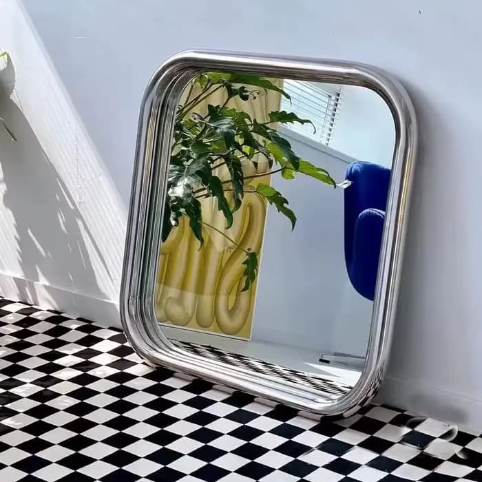 Miroir mural décoratif avec cadre en acier inoxydable