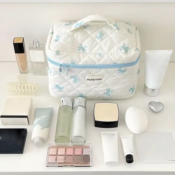 Trousse de maquillage matelassée à nœud blanc