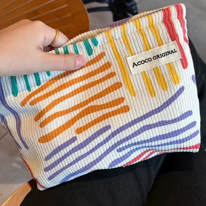Pochette cosmétique en velours côtelé à rayures colorées