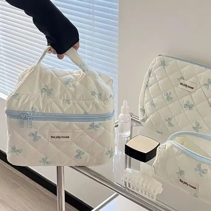 Trousse de maquillage matelassée à nœud blanc