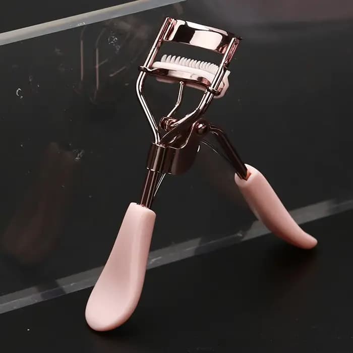 Recourbe-cils professionnel rose avec peigne pour des courbes parfaites