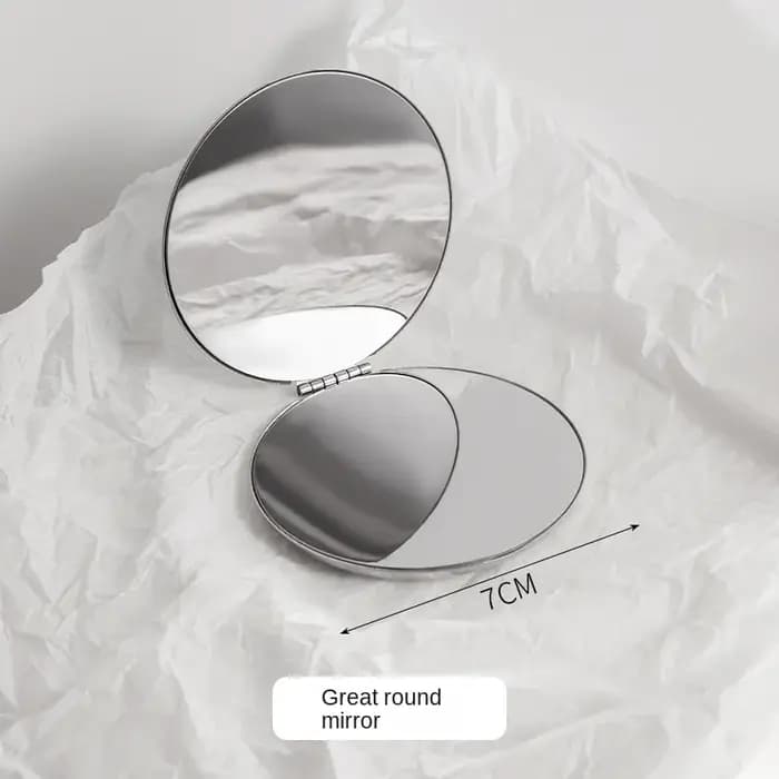 Petit miroir pliable double face